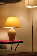 Bright eco light in the corner of a modern bedroom. New led technology meets traditional interior design.  
