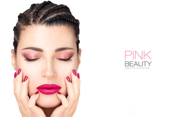 Beautiful fashion girl with braided hair, pink lipstick, nails and eye shadow. Beauty makeup concept