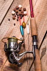 Fishing rod with a cortical handle and a fishing reel. A variety of floats. Fishing bait from boilies and pellets.