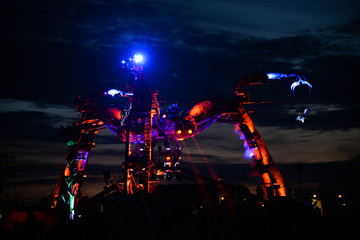 Obraz premium JUNE 23, 2015 : A view of the Arcadia show above the crowd at the first night of the Glastonbury Festival 2015 
