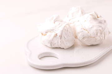 Fototapeta na wymiar dessert. French meringues with nuts, pistachios
