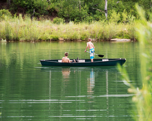 Boy Fishing on Pond