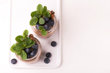 Cake dessert. Chocolate mousse with blueberry, mint and cinnamon