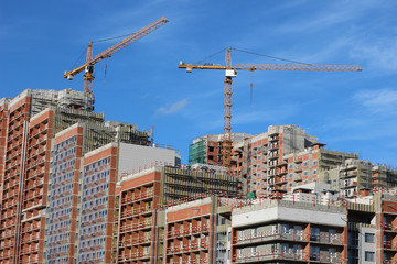Lots of tower Construction site with cranes and building with blue sky background
