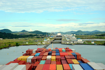 Container ship is entering Cocoli Locks when transiting Panama Canal.