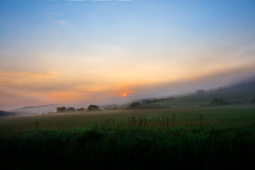 Beautiful morning on road. Sun is rising in mountains. Concept of road trip and traveling with car around Europe, Romania