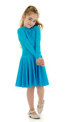 A cheerful little girl is dancing.