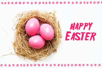 Fototapeta premium Easter colored pink eggs in egg nest, soft focus image. Happy Easter Card