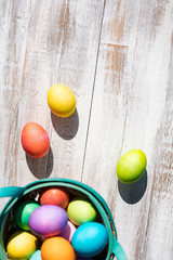 Bright And Colorful Easter Eggs On Weathered Wood