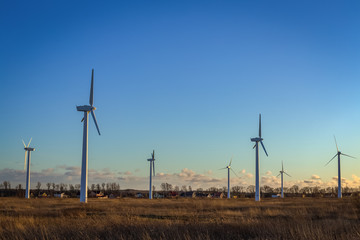 Wind turbines at sunset