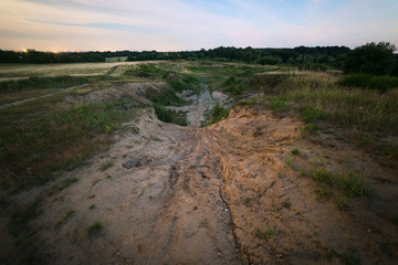 Old abandoned sand pit at night. Used as a moto track