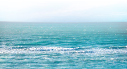 The clear turquoise sea of the Atlantic ocean on which are white waves. Above it is the blue sky. It's in the Caribbean in Cuba.