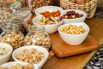Various piles of mixed nuts and seeds