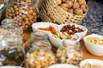 Various piles of mixed nuts and seeds