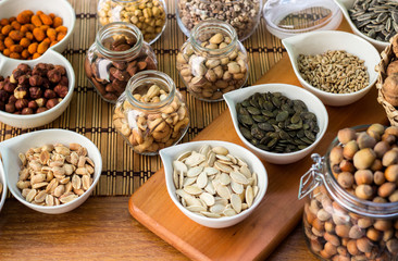 Various piles of mixed nuts and seeds