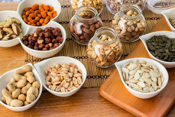 Various piles of mixed nuts and seeds
