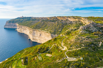 Fototapeta na wymiar Aerial view of Dingli cliffs. Greeny nature and blue sea and sky. Malta island. 