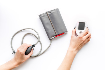 cardiologist work desk with pulsimeter on white background top view