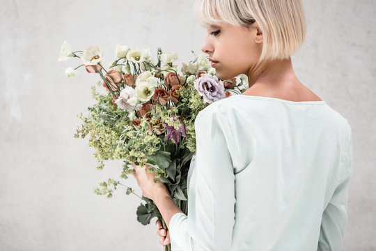 woman holding a boquet