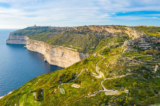 Aerial view of Dingli cliffs. Greeny nature and blue sea and sky. Malta island. 