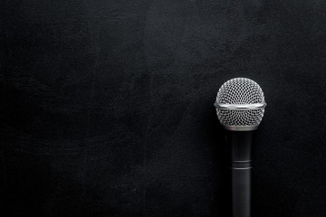 podcast record with microphone on black background top view space for text