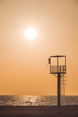 Almerimar beach lifeguard tower at sunset. Deserted beach, no people. Almeria, Andalusia, Spain