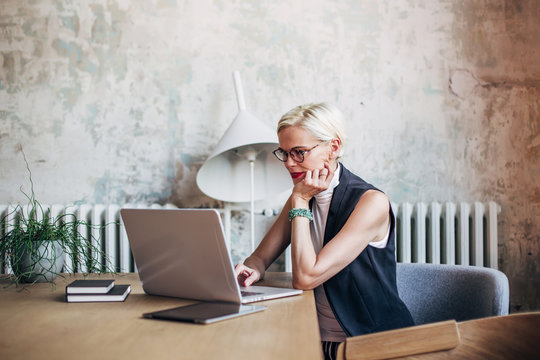 Businesswoman working on laptop at table