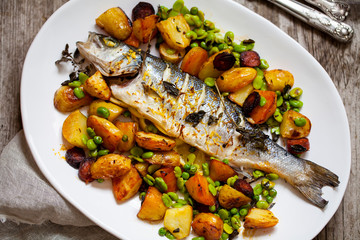 Roast sea bass with potato, chorizo and broad beans with lemon zest and thyme