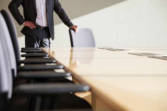 Male executive in conference room.