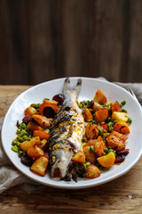 Roast sea bass with potato, chorizo and broad beans with lemon zest and thyme