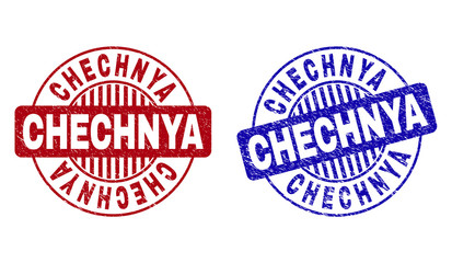 Grunge CHECHNYA round stamp seals isolated on a white background. Round seals with grunge texture in red and blue colors. Vector rubber watermark of CHECHNYA text inside circle form with stripes.