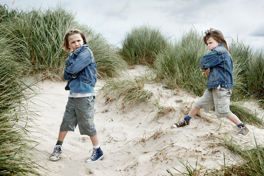 Two brothers playing on beach