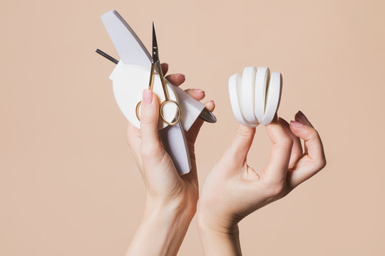 Woman Holding Manicure Accessories