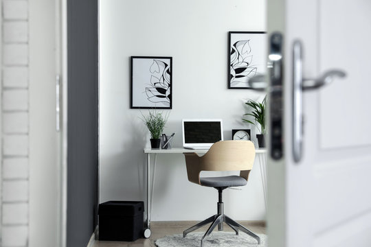 Stylish Home Office Interior, View Through Open Door