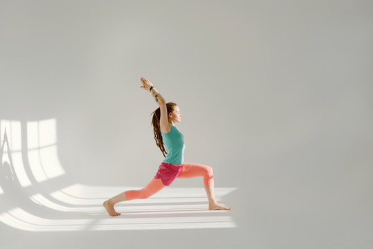 Girl practising warrior pose