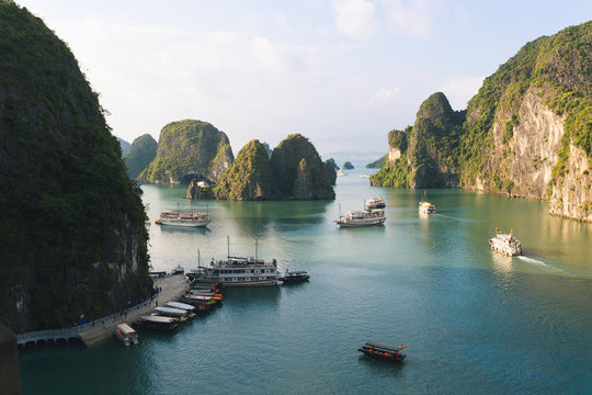 Tourist boats in the limestone towers of Ha Long bay
