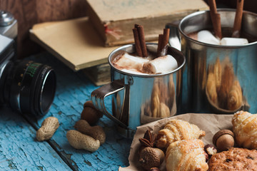 Metal mugs with cacao and marshmallows