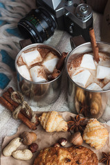 Metal mugs with cacao and marshmallows