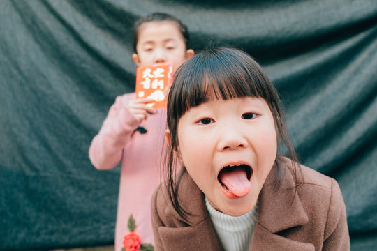 happy Chinese little girl with red packet