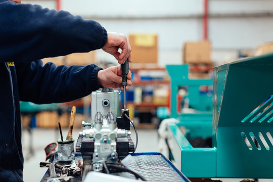 Reparing an engine in the factory.