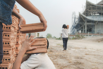 Children working at construction site for world day against child labour concept: