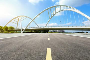Fototapeta na wymiar Empty asphalt road and bridge construction in shanghai