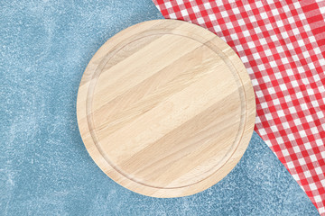 Cutting board or chopping board on wooden table.