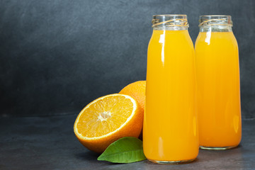 Fototapeta na wymiar Fresh orange juice in the glass bottle