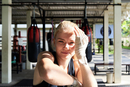 Female Muay Thai boxer work out.