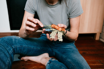woman enjoying her free time at home doing paper handcrafts