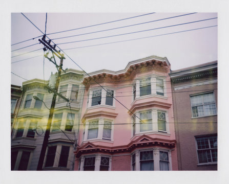 Polaroid (land camera) of pink and grey row houses in San Fransisco