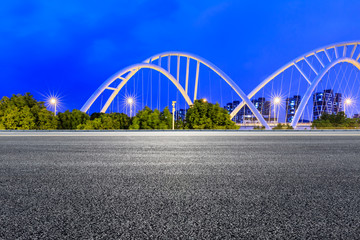 Empty asphalt road and bridge construction in shanghai at night