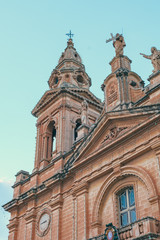 Fototapeta na wymiar Maltese church architecture close up sunset