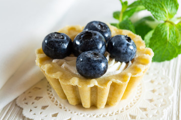 Delicious tartlet with fresh blueberries and cream cheese.